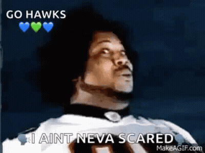 A Man In A Football Uniform Is Saying `` Go Hawks , I Ain T Neva Scared '' . GIF