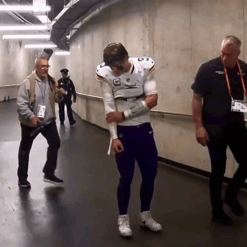 A Man In A Football Uniform With The Number 8 On His Chest GIF