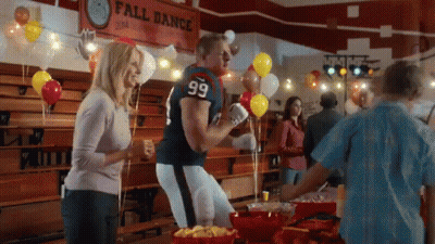 A Man In A Football Uniform With The Number 99 On His Jersey GIF