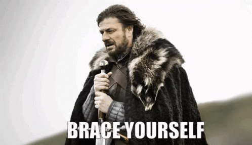 A Man In A Fur Cape Is Holding A Sword And The Words Brace Yourself Are Above Him GIF