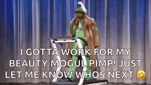A Man In A Fur Coat And Hat Is Standing On A Treadmill On A Stage . GIF