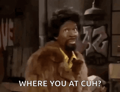 A Man In A Fur Coat Is Asking Where You At Cuh GIF