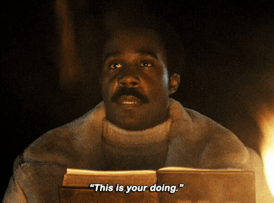 A Man In A Fur Coat Is Holding A Book And Says " This Is Your Doing " GIF