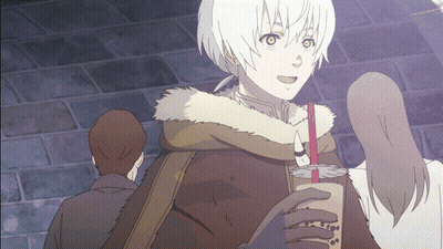 A Man In A Fur Coat Is Holding A Bubble Tea Cup GIF