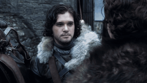 A Man In A Fur Coat Looks At Another Man In A Fur Coat GIF