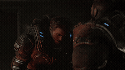 A Man In A Futuristic Armor With A Light On His Chest GIF