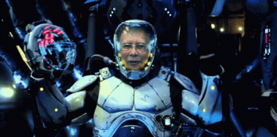 A Man In A Futuristic Suit With A Helmet That Says ' Vc ' On It GIF