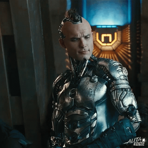 A Man In A Futuristic Suit With The Word Alita On The Bottom GIF