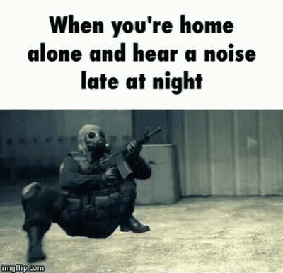 A Man In A Gas Mask Is Holding A Gun And The Caption Says When You 'Re Home Alone GIF