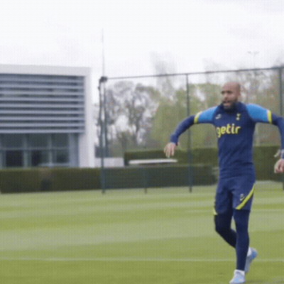 A Man In A Getir Shirt Is Running On A Soccer Field GIF
