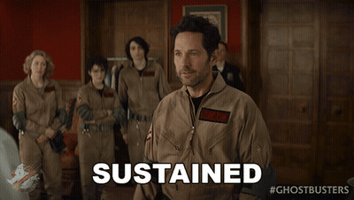 A Man In A Ghostbusters Uniform Says Sustained In Front Of A Group Of People GIF