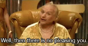 A Man In A Gold Shirt Is Sitting In A Chair And Says `` Well , Then There Is No Pleasing You . '' GIF