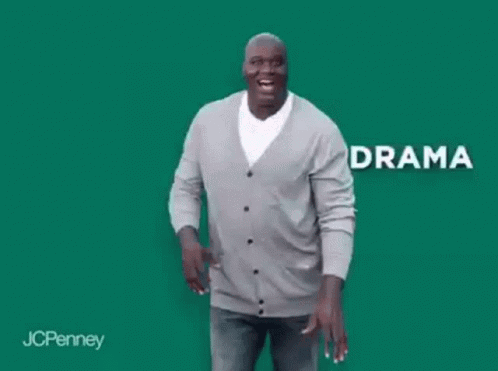 A Man In A Gray Cardigan Is Dancing In Front Of A Green Background With The Word Anxiety . GIF