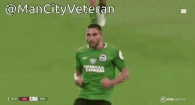 A Man In A Green American Express Jersey Is Covering His Face With His Hands GIF