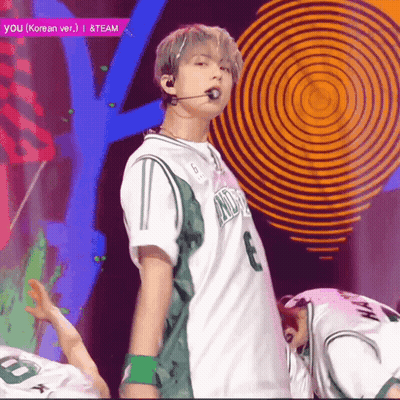 A Man In A Green And White Jersey With The Number 3 On The Front GIF