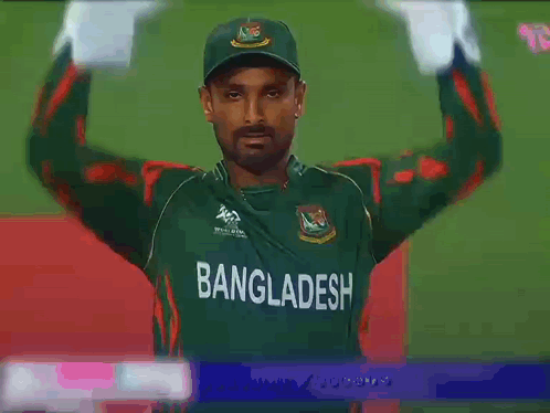 A Man In A Green Bangladesh Jersey Holds His Hands Up GIF