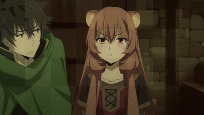A Man In A Green Cape Stands Next To A Girl In A Brown Outfit GIF