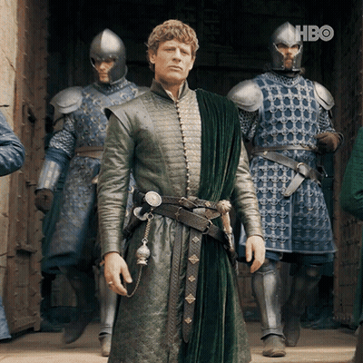 A Man In A Green Coat Is Standing In Front Of A Group Of Soldiers With Hbo Written On The Bottom Right GIF