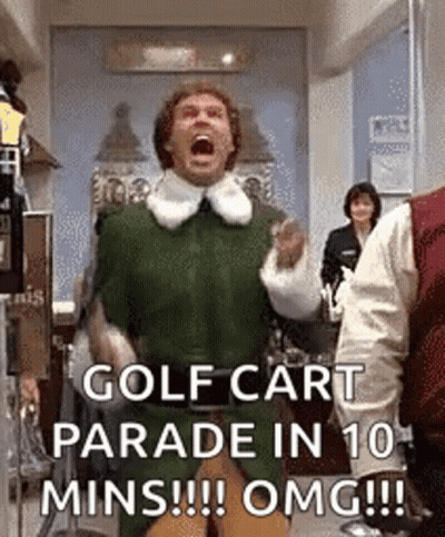 A Man In A Green Elf Costume Is Screaming In A Golf Cart Parade In 10 Mins . GIF