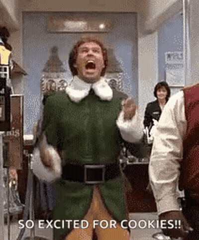 A Man In A Green Elf Costume Is Screaming While Standing In A Room . GIF