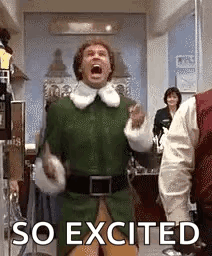 A Man In A Green Elf Costume Is Standing In A Room With His Mouth Open And Yelling . GIF