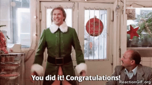 A Man In A Green Elf Costume Is Standing In Front Of A Door And Saying You Did It Congratulations . GIF