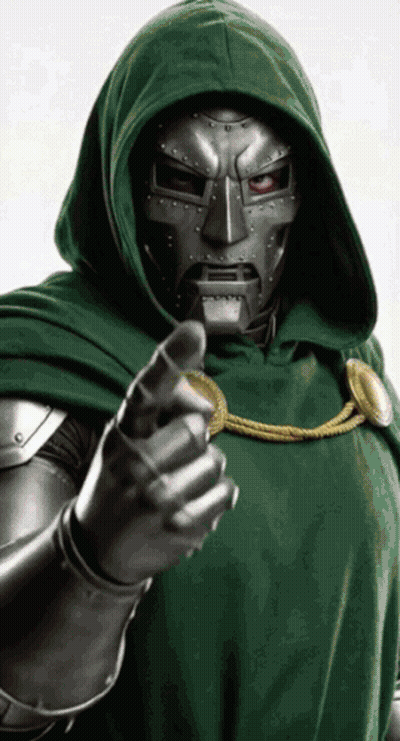 A Man In A Green Hooded Cloak Is Pointing His Finger GIF