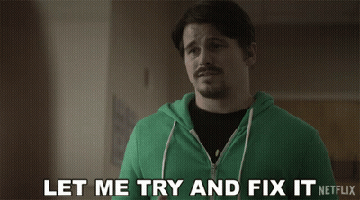A Man In A Green Hoodie Is Saying " Let Me Try And Fix It " GIF