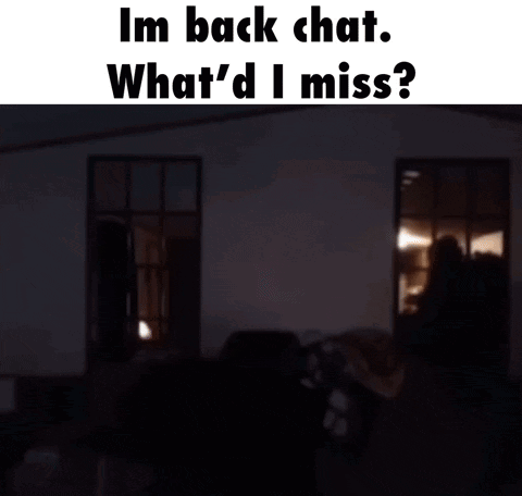 A Man In A Green Hoodie Is Standing In A Dark Room With The Words Im Back Chat What 'D I Miss GIF