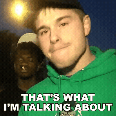 A Man In A Green Hoodie Is Talking About Something GIF
