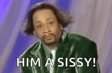 A Man In A Green Jacket And Tie Is Saying `` Him A Sissy '' . GIF