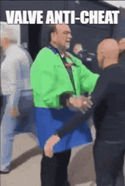 A Man In A Green Jacket Is Shaking Hands With Another Man In A Black Shirt . GIF