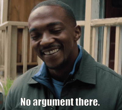 A Man In A Green Jacket Is Smiling And Says " No Argument There " GIF
