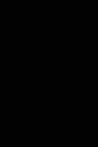 A Man In A Green Jacket Looks Out A Window GIF