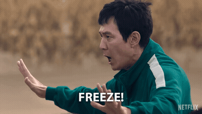 A Man In A Green Jacket Says " Freeze " GIF