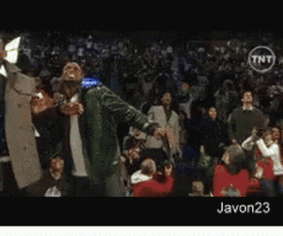 A Man In A Green Jacket Stands In Front Of A Crowd With A Tnt Logo On The Bottom GIF