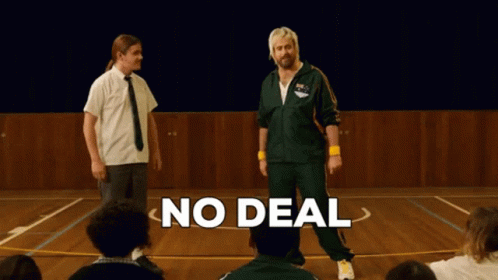 A Man In A Green Jacket Stands In Front Of A Group Of People With The Words No Deal Above Him GIF