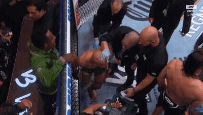 A Man In A Green Jacket With The Word Ufc On His Back GIF