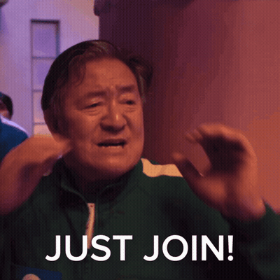 A Man In A Green Jacket With The Words Just Join Written On It GIF