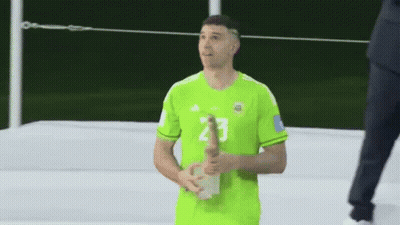 A Man In A Green Jersey With The Number 2 On His Shorts GIF