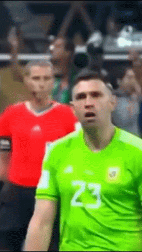 A Man In A Green Jersey With The Number 23 On The Front GIF