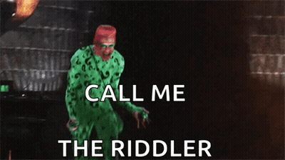 A Man In A Green Riddler Costume Is Screaming And Says Call Me The Riddler GIF