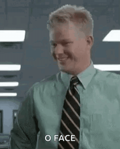 A Man In A Green Shirt And Tie Is Smiling And Saying `` O Face '' . GIF
