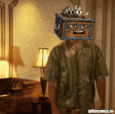 A Man In A Green Shirt Has A Crate On His Head GIF