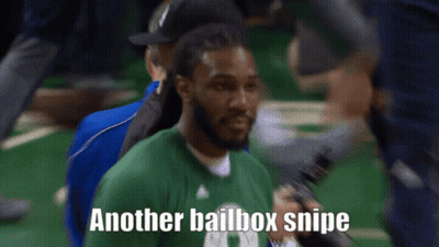 A Man In A Green Shirt Holds A Microphone And Says " Another Bailbox Snipe " GIF