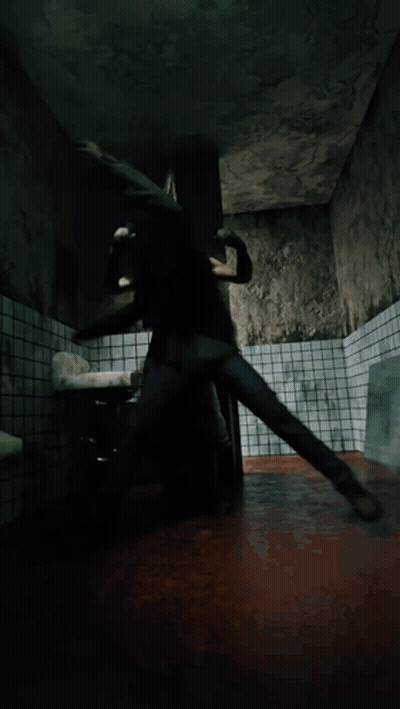 A Man In A Green Shirt Is Laying On The Floor GIF