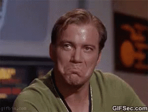 A Man In A Green Shirt Is Making A Funny Face With His Mouth Open . GIF