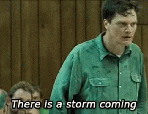 A Man In A Green Shirt Is Saying There Is A Storm Coming . GIF