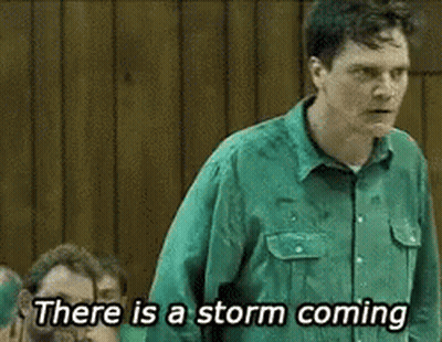 A Man In A Green Shirt Is Saying There Is A Storm Coming . GIF