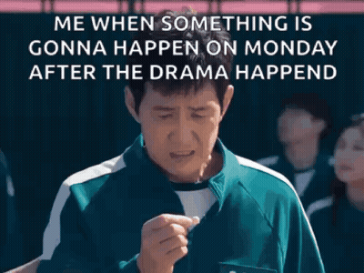 A Man In A Green Shirt Is Standing In Front Of A Group Of People And A Sign That Says Me When Something Is Gonna Happen GIF